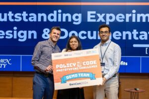 Our incredible students, Jason Goodman, MPP/MBA candidate, Alessandra Garcia Guevara, computer science undergraduate candidate, and Kenny Mohammed, computer science PhD candidate, presenting at the Policy2Code Demo Day